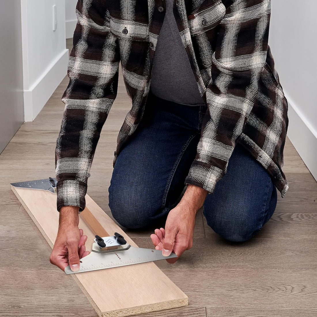 Contractor using Staircision Stair Tread Template Tool to layout precise cuts for a wood step installation - Eleon Direct