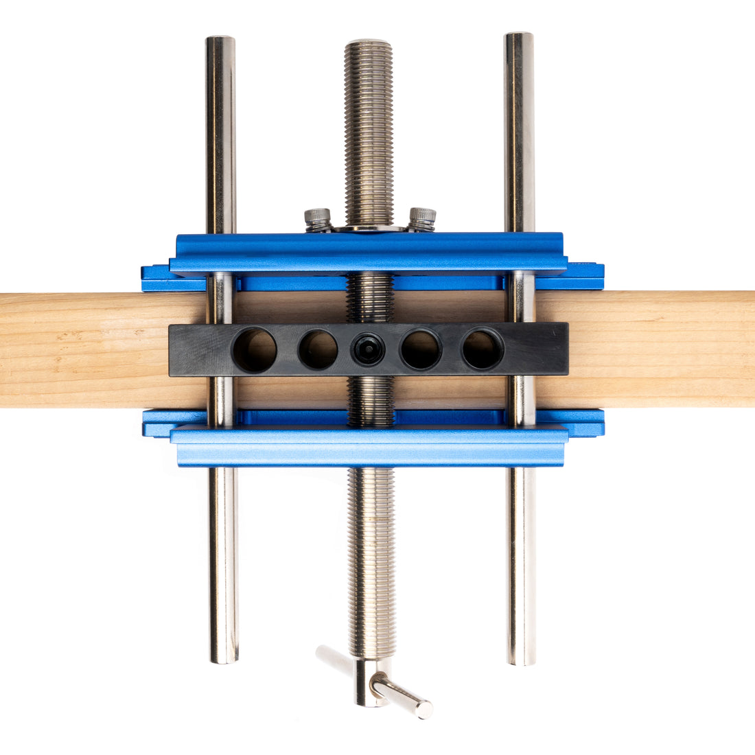 Eleon Self-Centering Dowel Jig Top View: Demonstrating the precision self-centering mechanism on a wooden board - Heavy-duty parallel guide rods for perfect hole alignment in furniture joinery.